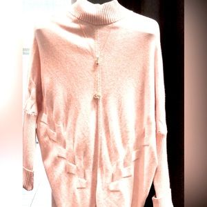 Gorgeous Frank Lyman Sweater with cable knit design.